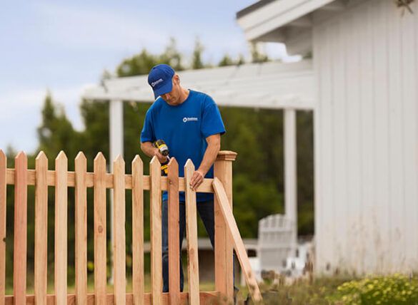 Fresh-stained fence in Euless