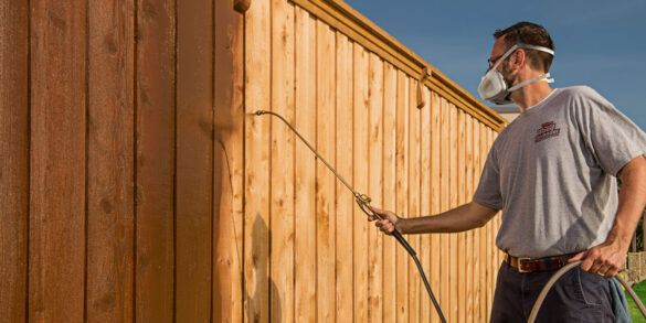 Powerwashing and restaining a cedar fence in Mesquite, TX